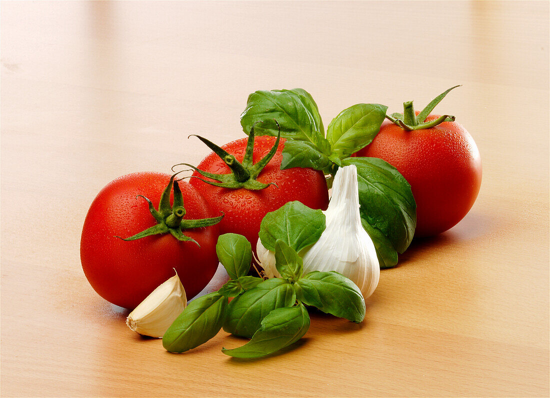 Still life with tomatoes, garlic, and basil