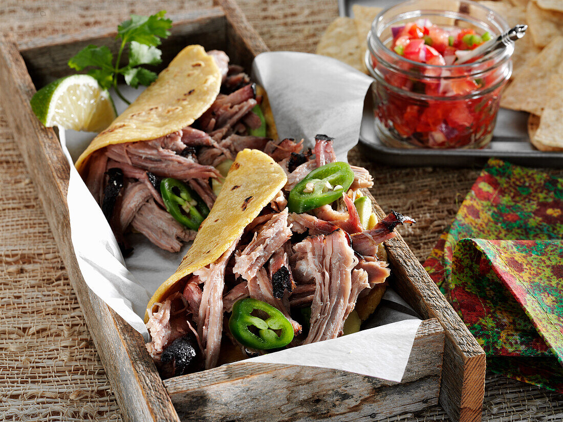 Tacos with smoked pulled pork and jalapenos