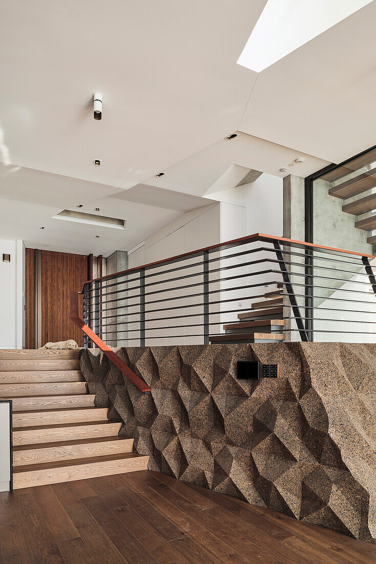 Front entrance and landing with cork wall in architect's house