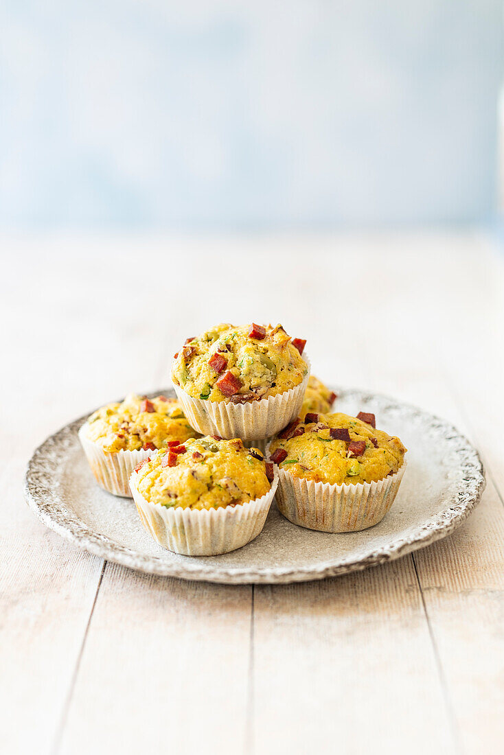 Hearty muffins with salami, olives and dried tomatoes