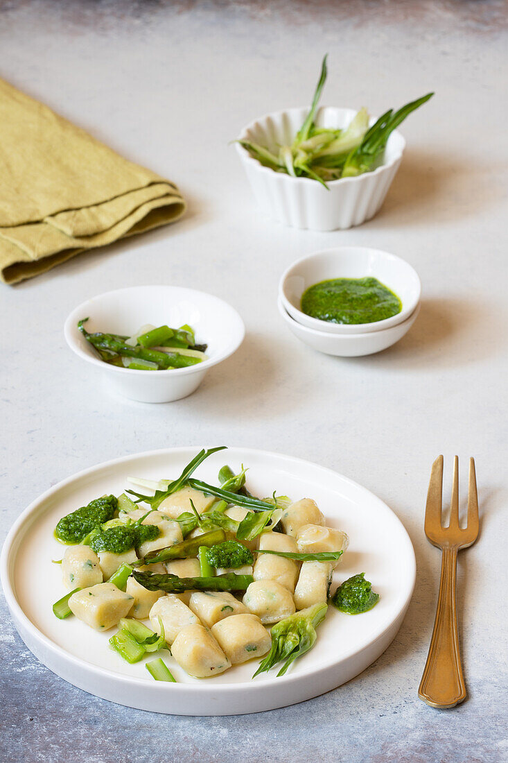 Ricotta and rocket gnocchi with asparagus and chicory