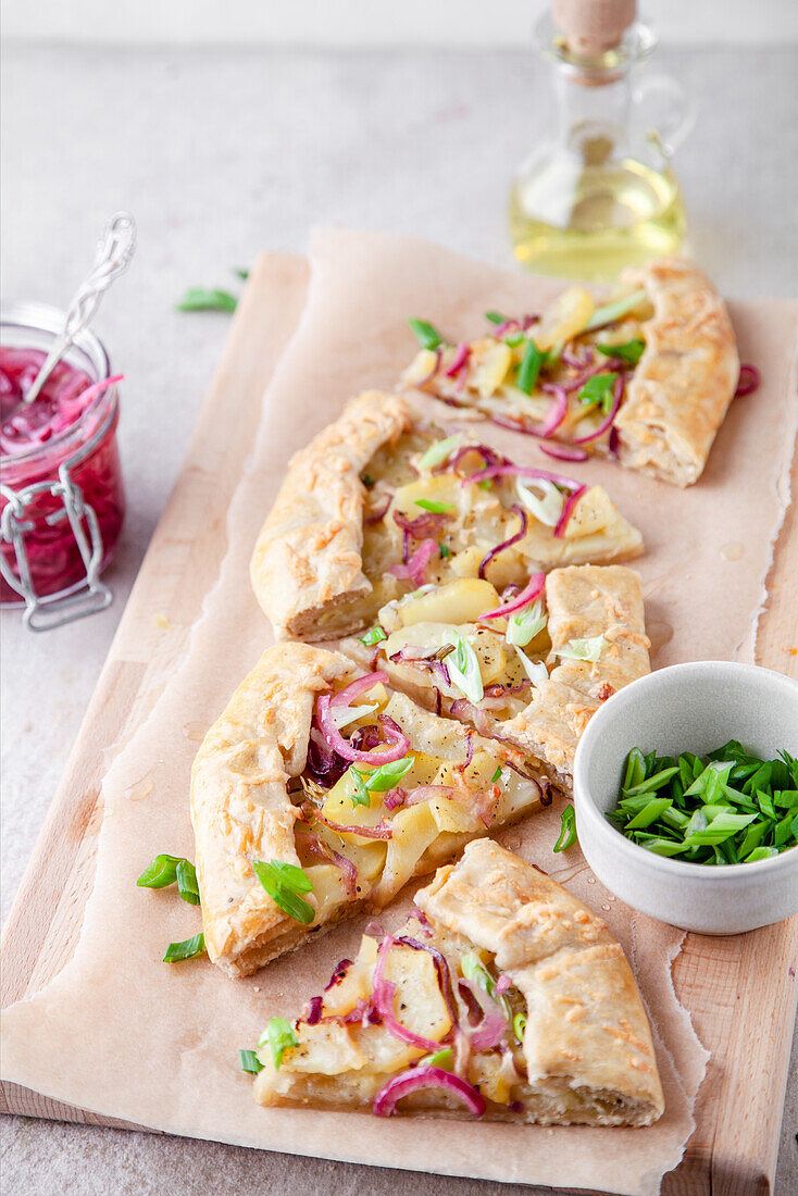 Potato galette with pickled red onions and green spring onions