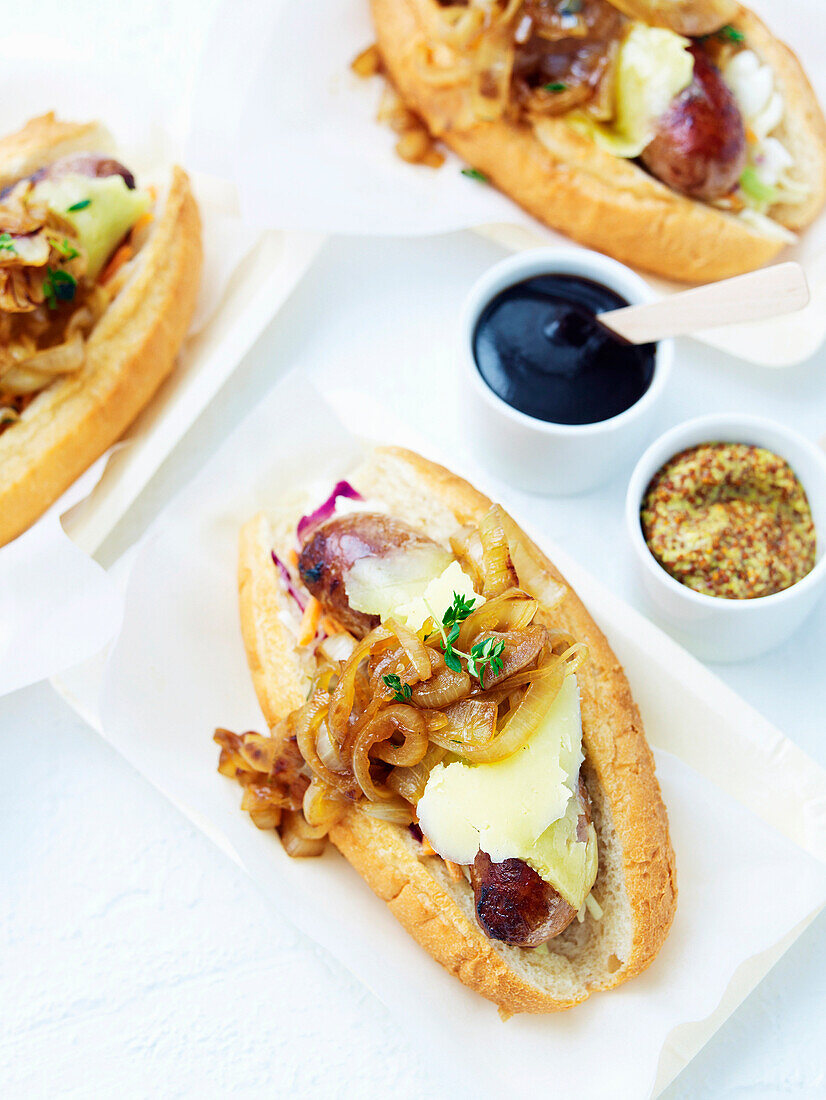 Hot dogs with cider-braised onions