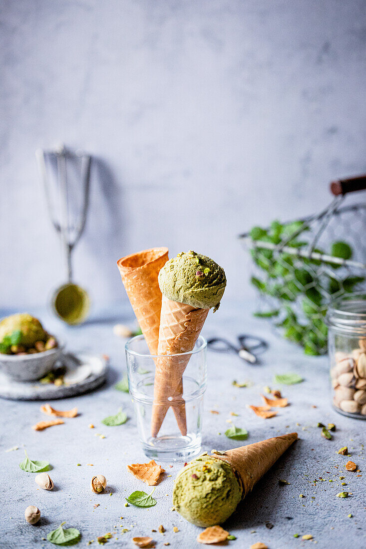 Pistachio ice cream in a waffle cone