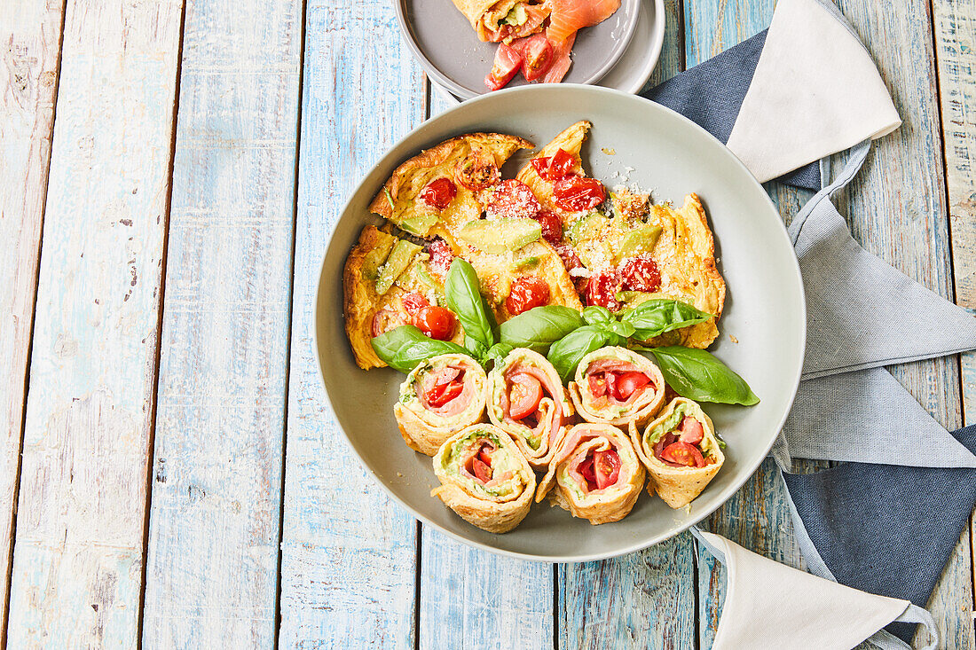 Omelet breakfast wraps with tomatoes