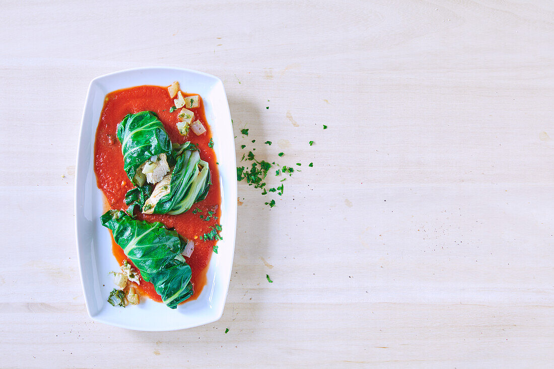 Bok choy chicken roulade with tomato sauce