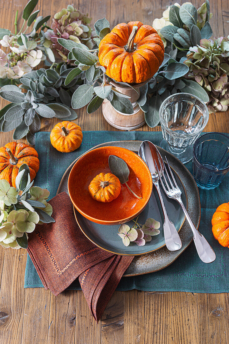 Autumn table decoration with pumpkins