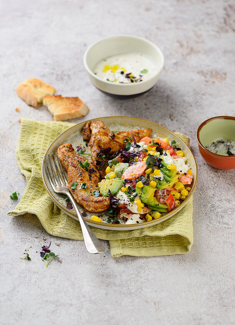 Spicy chicken fillets with avocado-corn salad