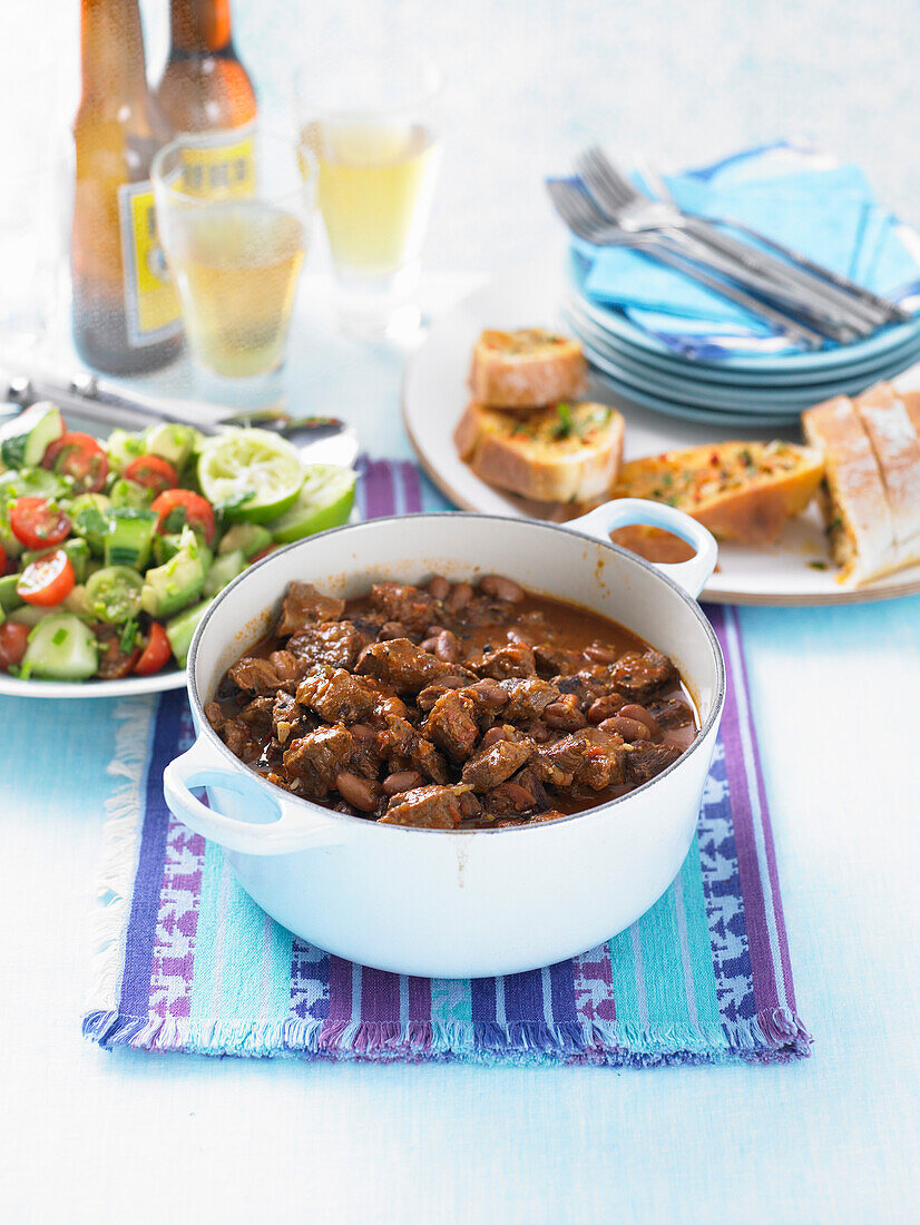 Mexican beef chili with avocado salsa and garlic bread