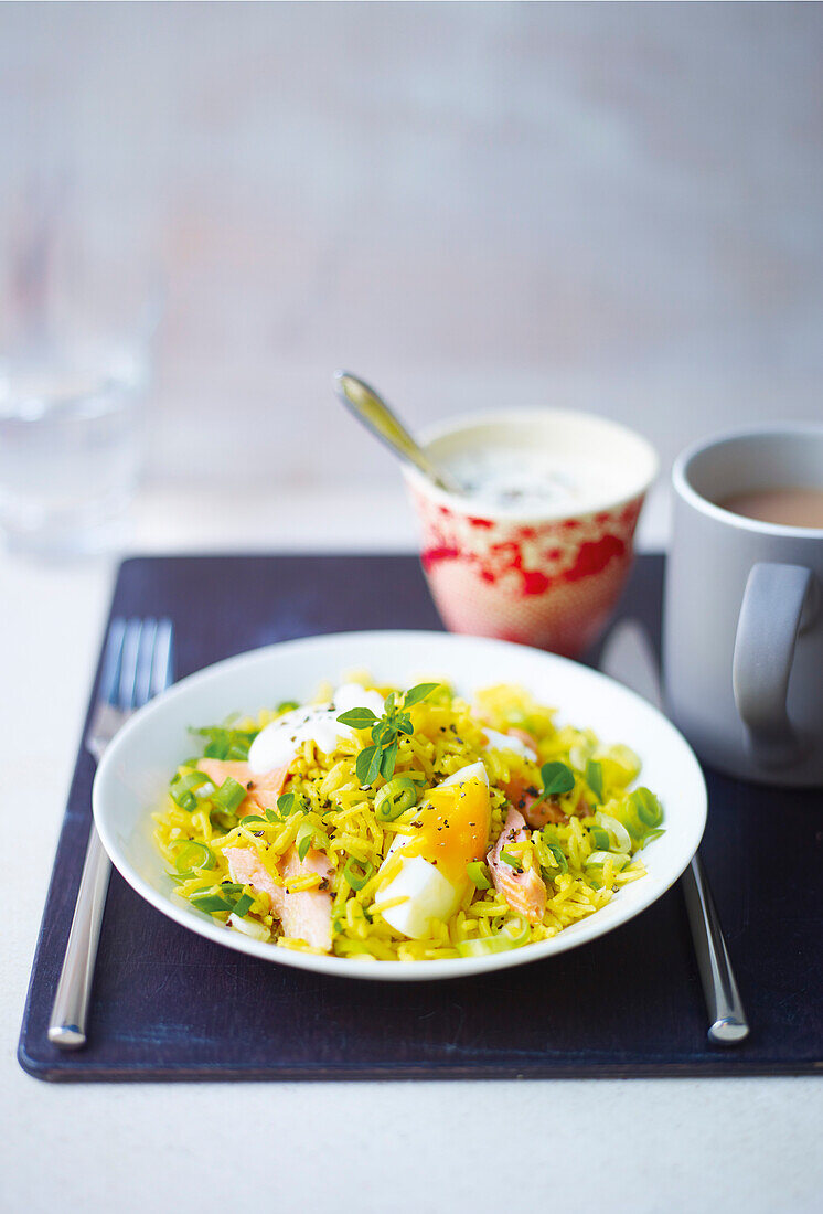 Hot smoked trout kedgeree with spring onions and basil