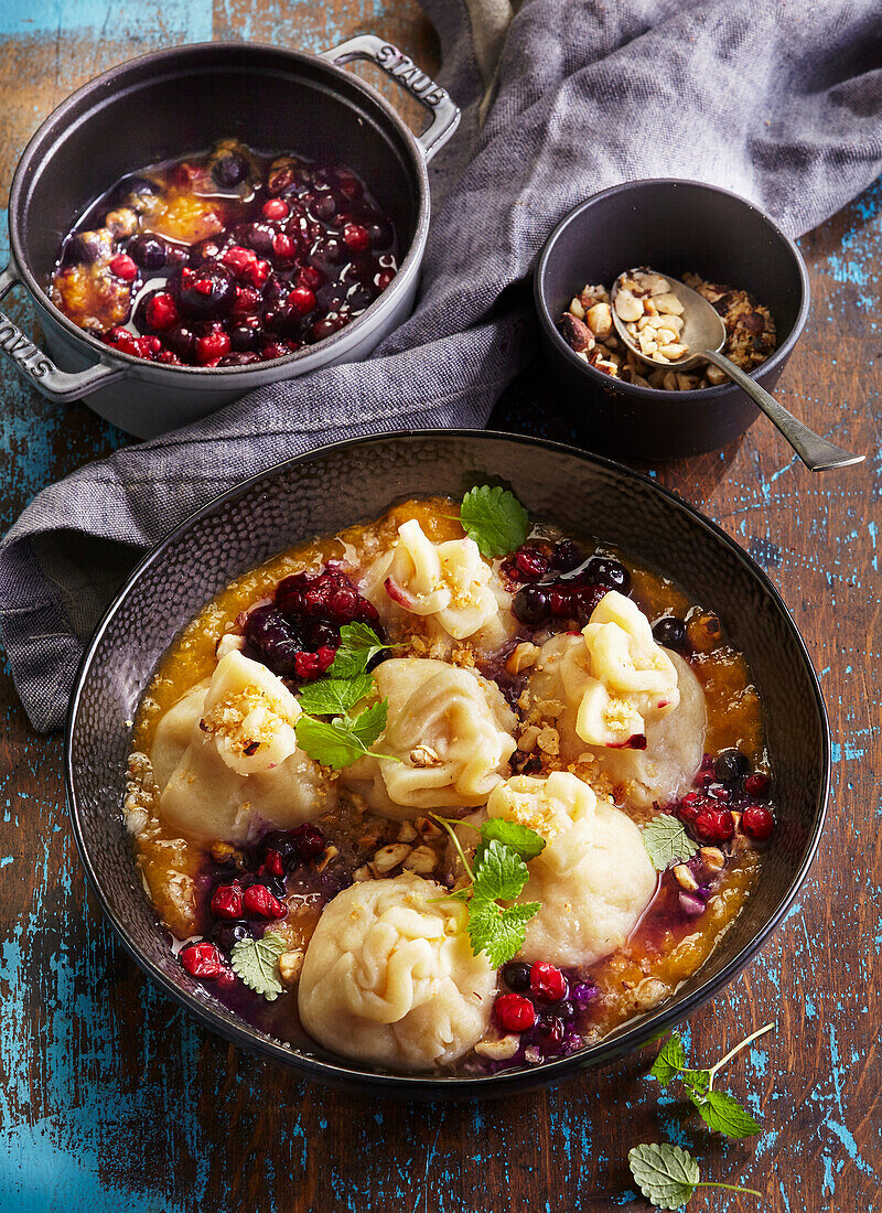 Sweet apricot dumplings with hazelnut crumbs