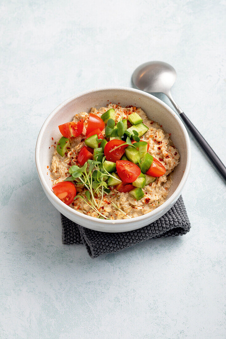 Spicy raw vegetable muesli with avocado and tomatoes