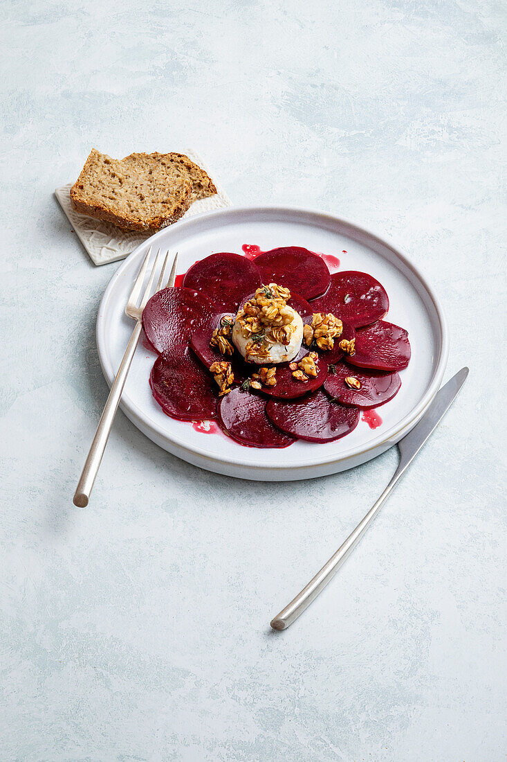 Beet carpaccio with toasted oat flakes and walnuts