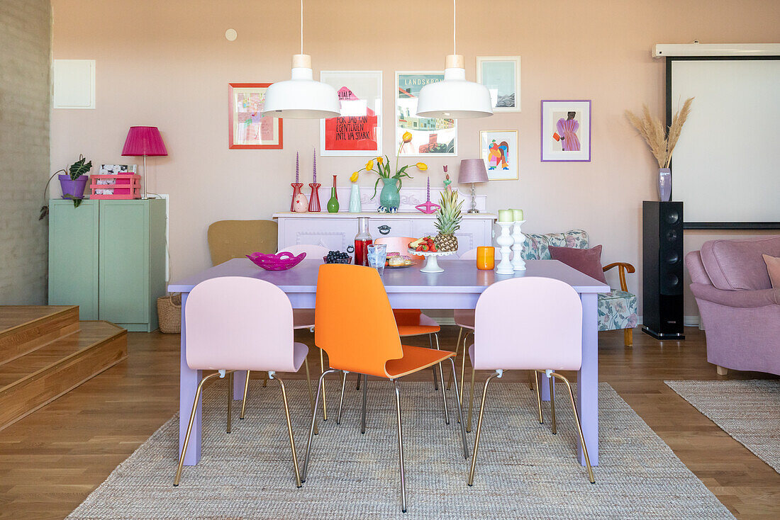 Colourful dining area with modern chairs and wall decorations