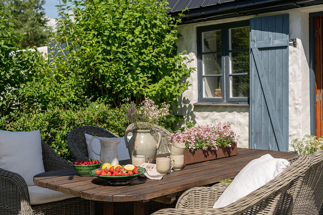 Outdoor table setting with fruit and plants