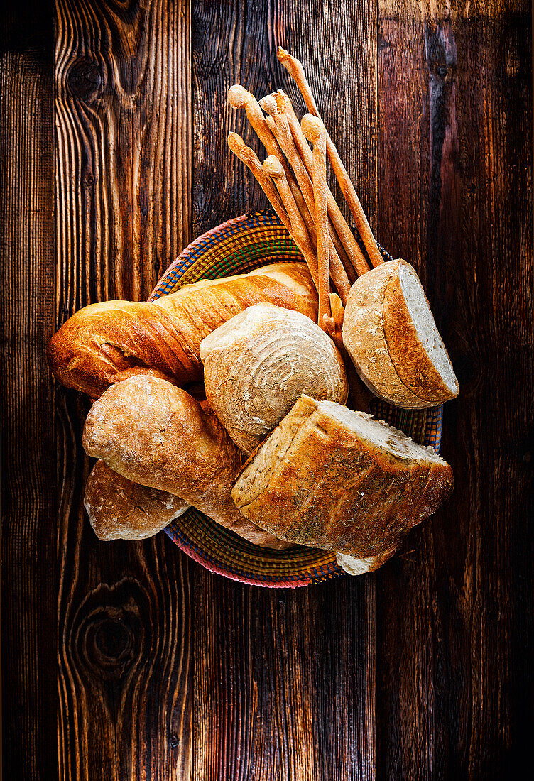 Bread basket with Italian breads - ciabatta, focaccia, grissini