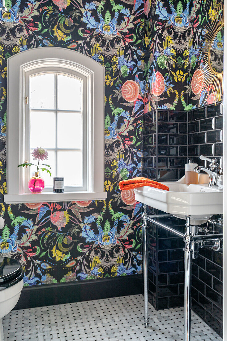 Bathroom with colorful patterned wallpaper and metro tiles