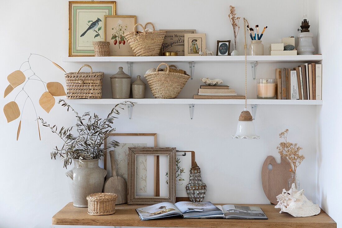 Wall shelf with vintage-style decorative items and dried plants