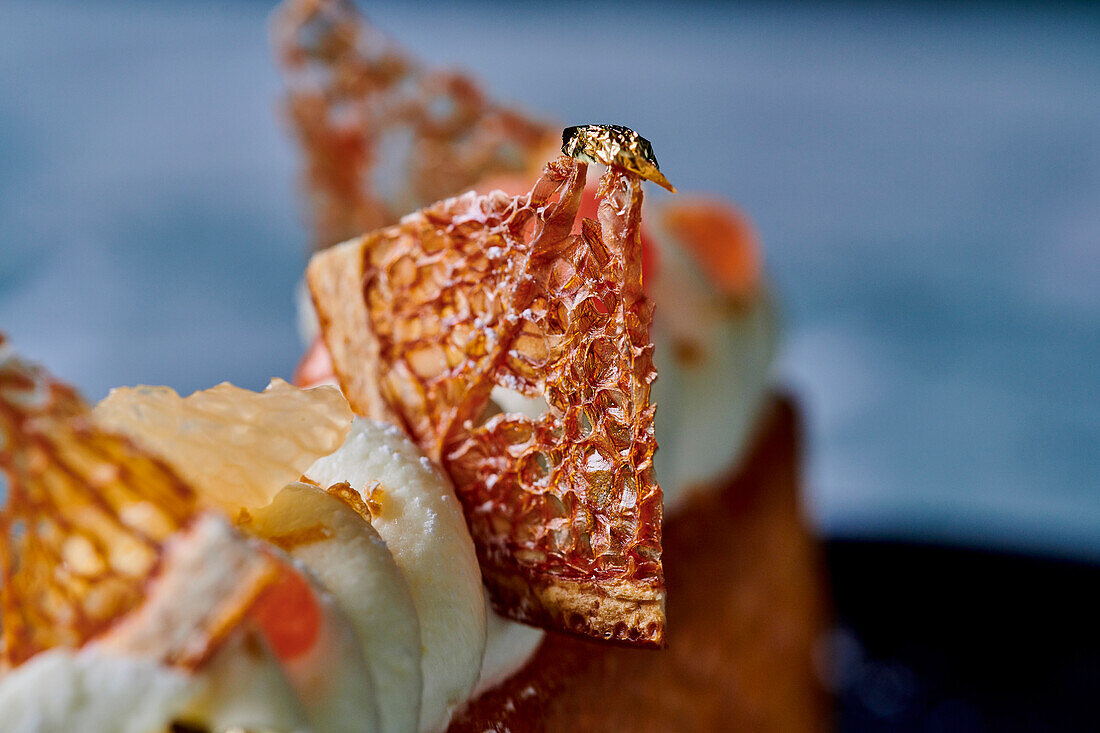 Festive grapefruit dessert with gold leaf