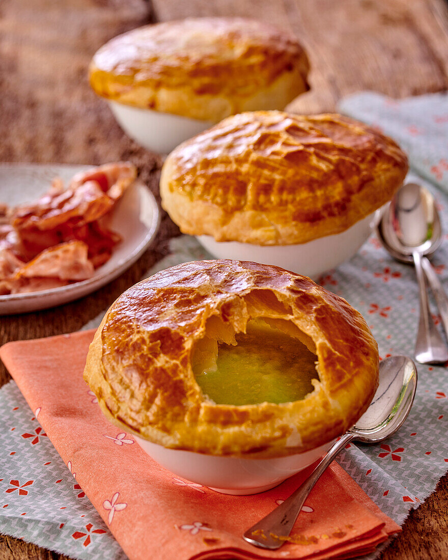 Potato and leek soup under a puff pastry crust