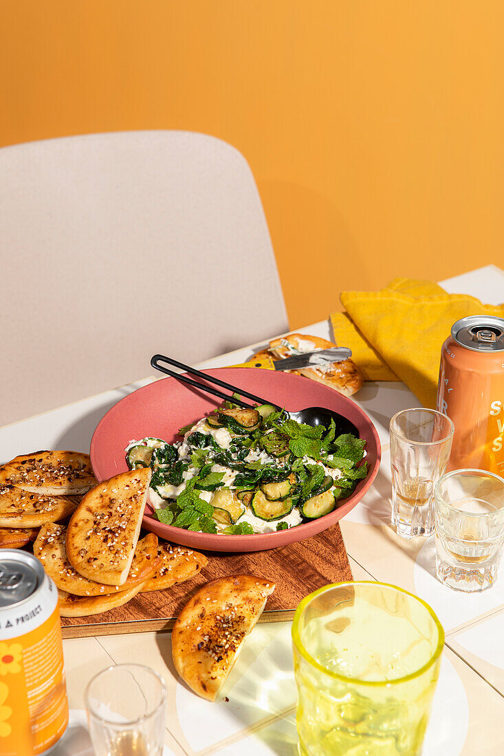 Zucchini and spinach raita with spiced flatbreads