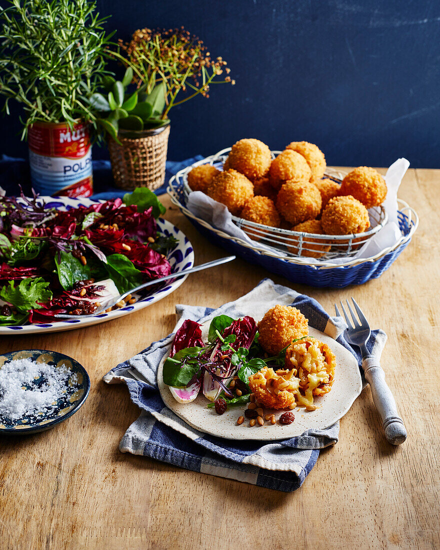 Crispy cheesy arancini with radicchio salad