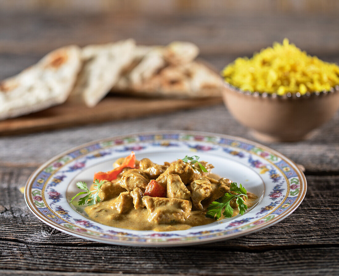 Indian chicken masala with basmati rice and naan