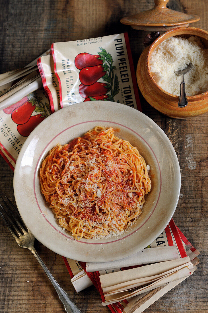 Spaghetti with tomato sauce and grated Parmesan cheese