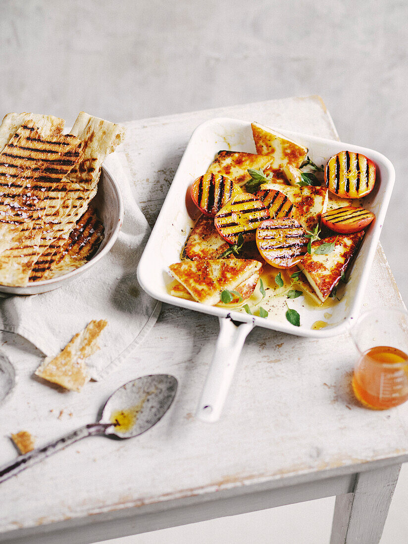 Saganaki cheese with grilled peaches and honey