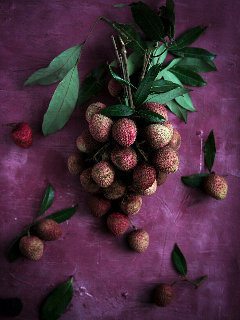 Lychees on a purple background