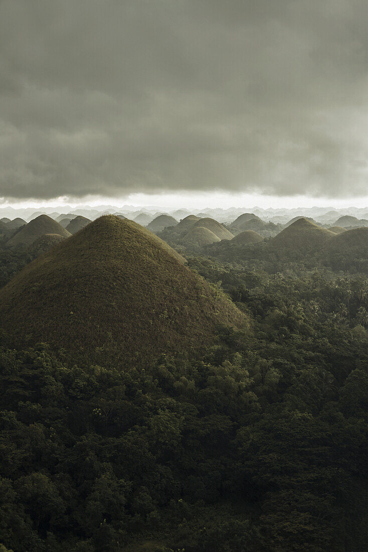 Chocolate Hills Landscape From Bohol Island, A Big Storm Covers The Sky Making An Interesting Lighting Effect; Carmen, Bohol Island, Philippines