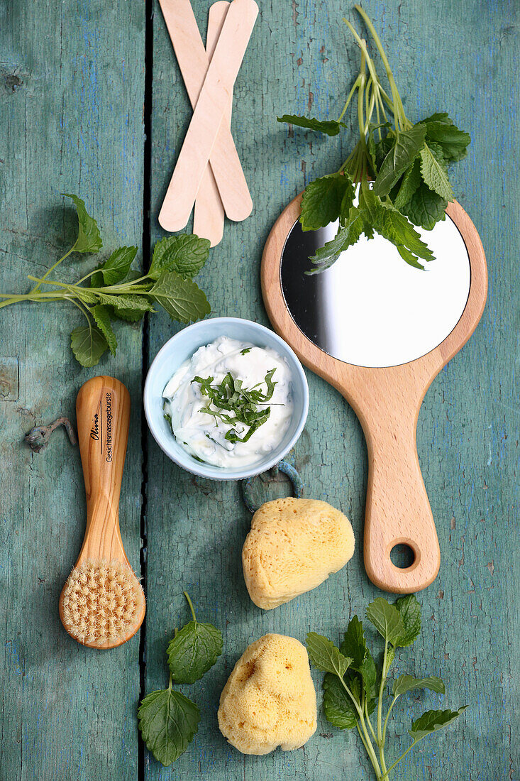 Face mask of lemon balm, curd and honey for sallow and reddened skin