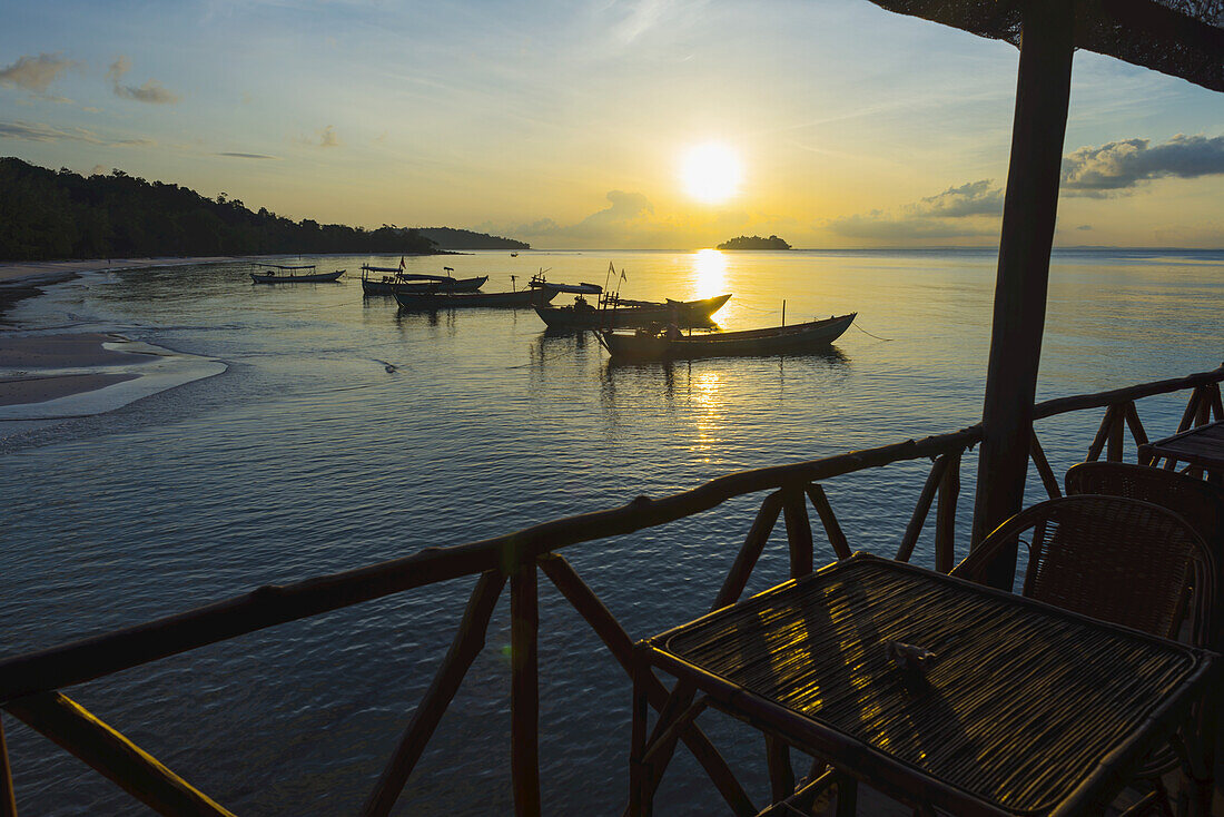 Boats Moored In The Harbour At Sunset Off Tui Beach, Koh Rong Island; Sihanoukville, Cambodia