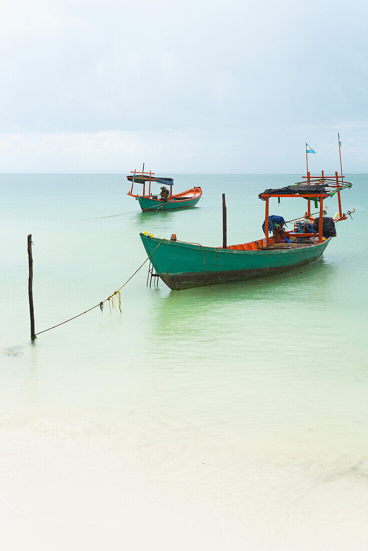 Boats Moored In The Shallow Water Off Tui Beach, Koh Rong Island; Sihanoukville, Cambodia