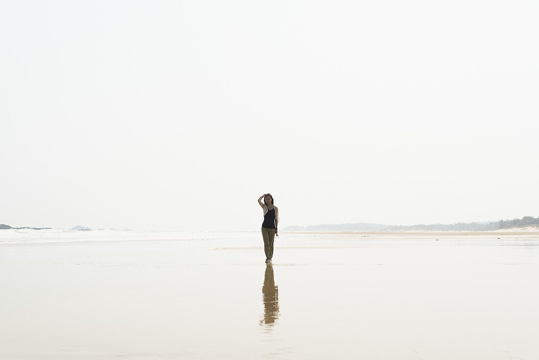 Young Woman Walking On The Beach From Huohu, North Of Kinmen Island; Taiwan