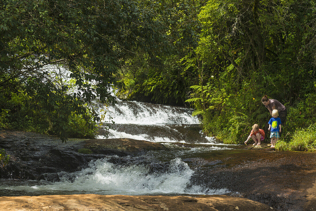 Mother With Boy And Girl Beside Small Waterfalls, Zomba Plateau; Malawi