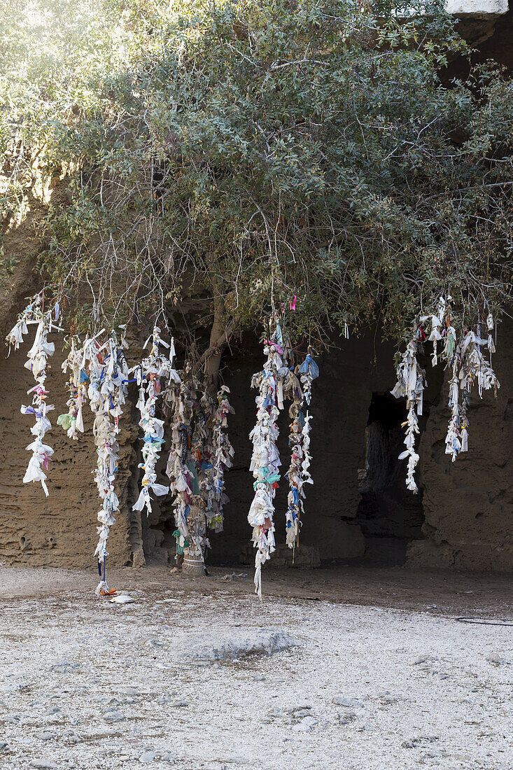 Items Tied And Hanging From A Tree; Paphos, Cyprus
