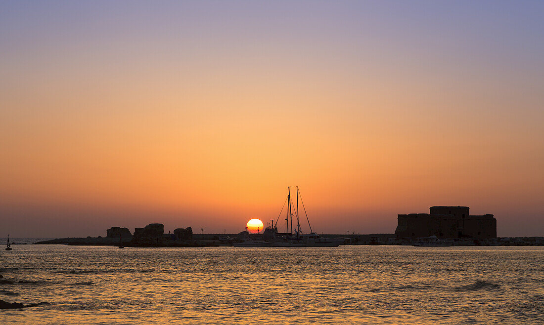 Dramatic And Colourful Sunset Over The Harbour; Paphos, Cyprus