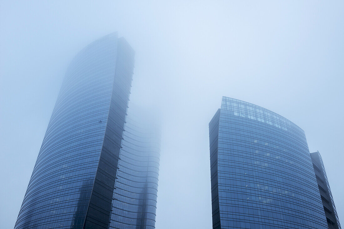 Skyscrapers In The Fog In The Business District, Porta Nuova; Milan, Lombardy, Italy
