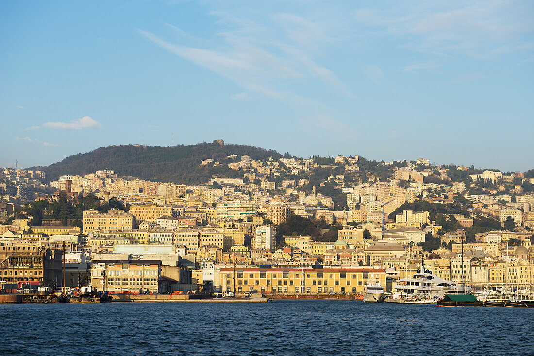 Boats In The Harbour And Buildings On The Waterfront; Genoa, Liguria, Italy