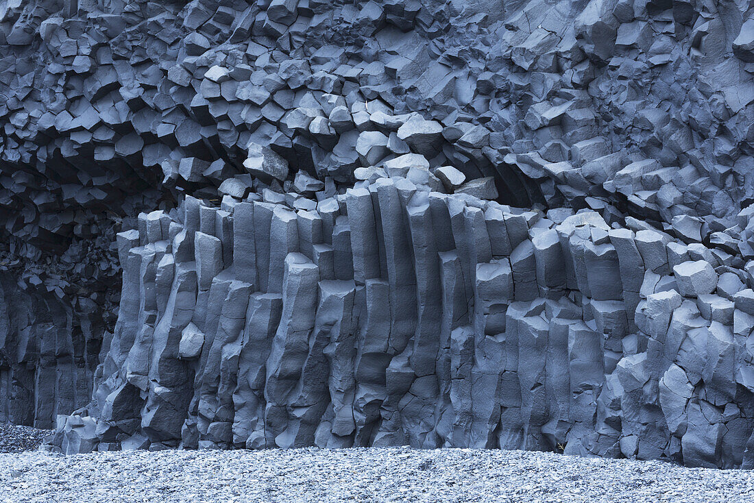 Hexagonal Basalt Columns Rise Out Of The Earth Near The Beaches Of Vik; Iceland