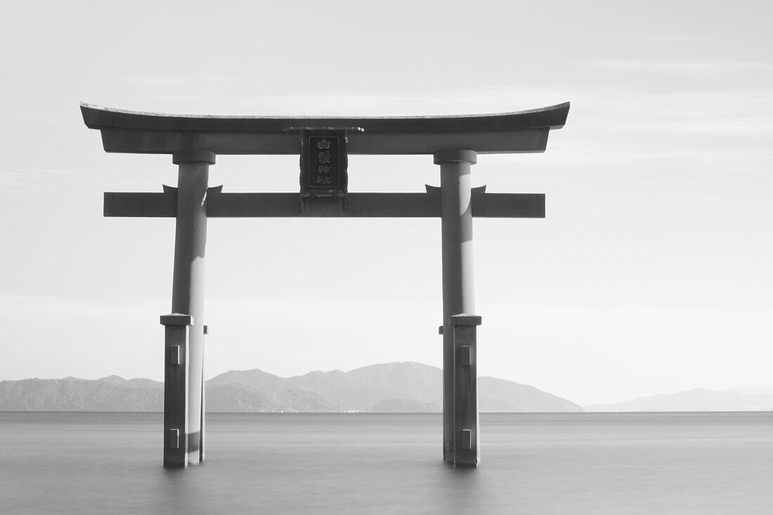 Black And White Image Of A Floating Shrine On A Lake; Takashiyama, Shiga, Japan