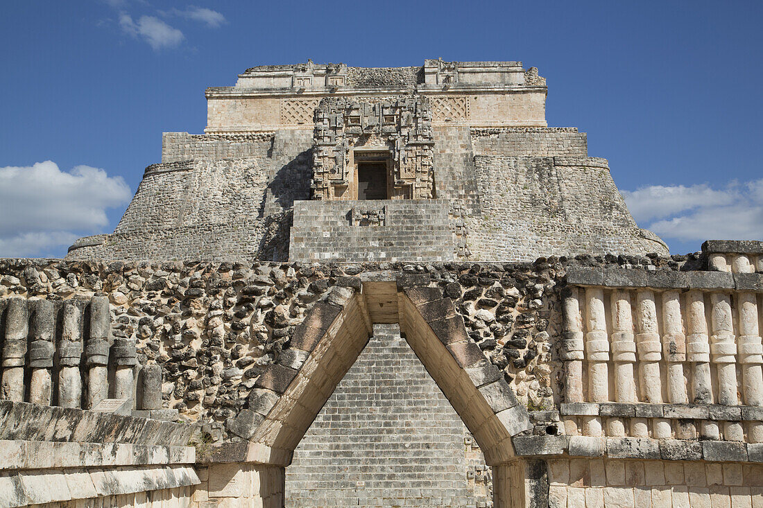 Corbelled Arch (Foreground), Pyramid Of The Magician (Background), Uxmal Mayan Archaeological Site; Yucatan, Mexico