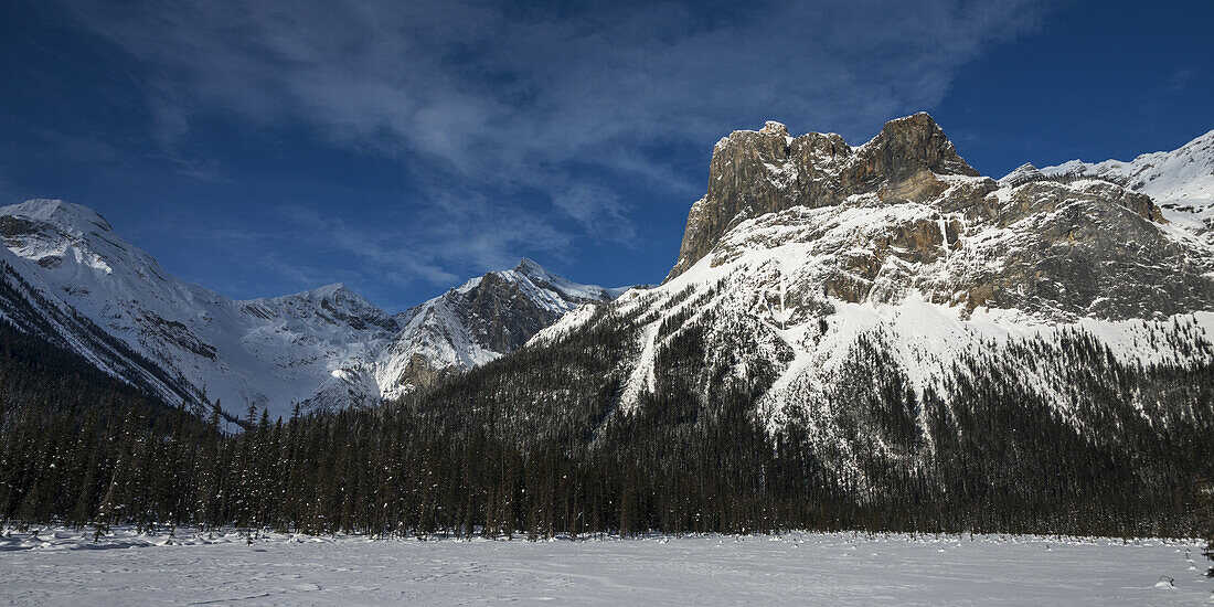 Snow On The Rugged Canadian Rocky Mountains And A Snow Covered Field, Yoho National Park; Field, British Columbia, Canada
