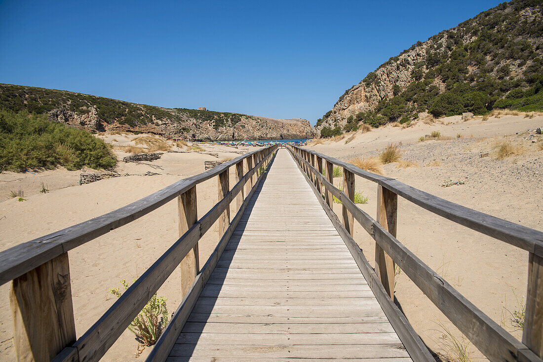 Wooden Boardwalk On The Beach At Cala Domestica; Carbonia Iglesias, Sardinia, Italy