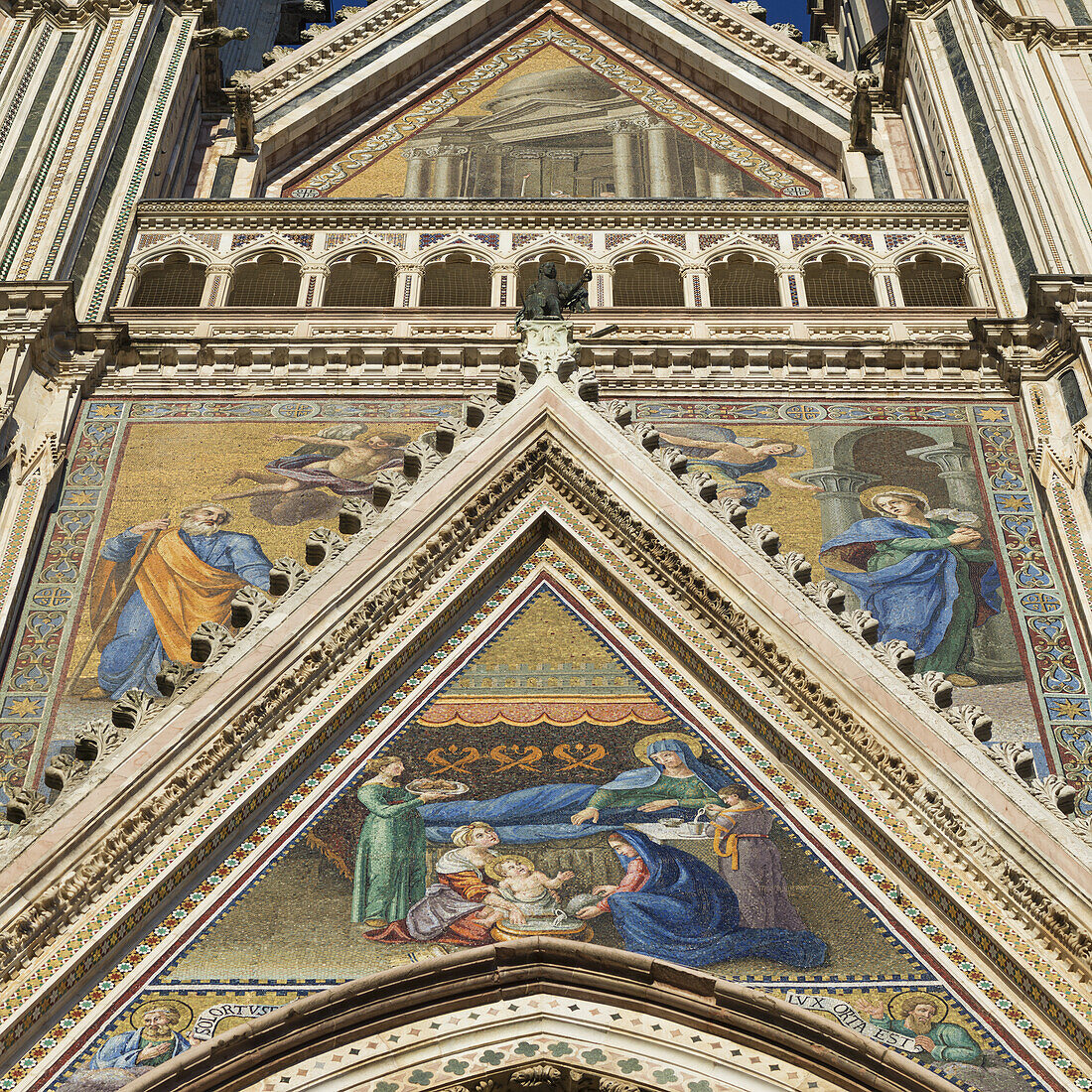 Low Angle View Of The Colourful Painted Facade Of Orvieto Cathedral; Orvieto, Umbria, Italy