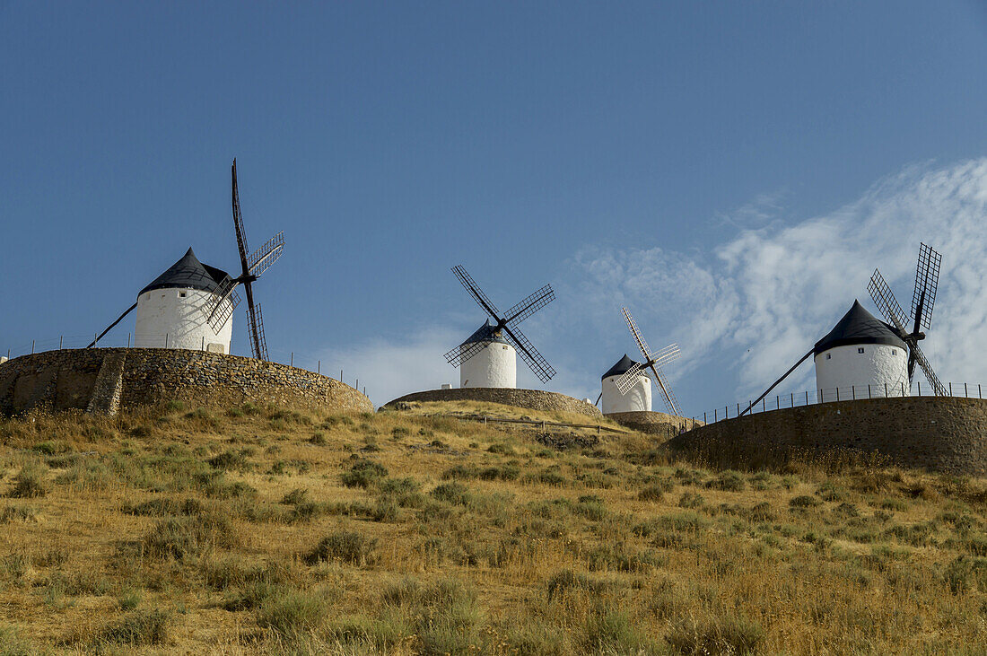 Windmills In A Row Against A Blue Sky; Consuegra, Spain