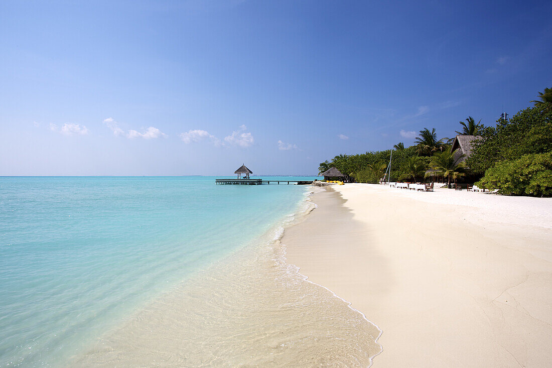 Classic White Sand Beach With Blue Sea And Overwater Cabana
