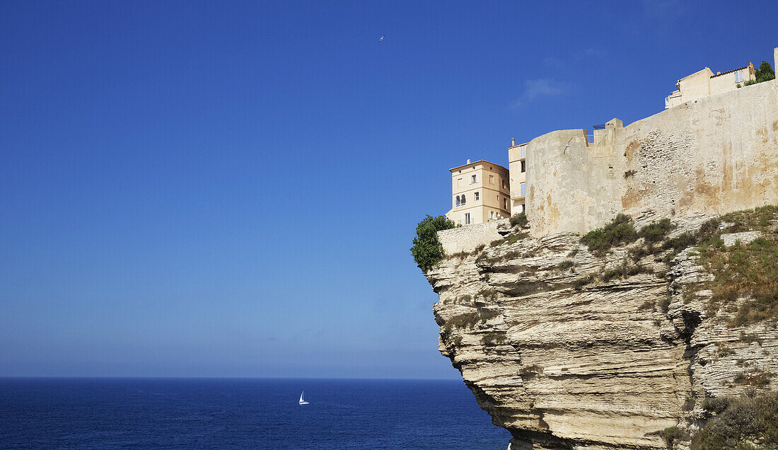 Bonifacio Citadel Perched On Dramatic White Cliffs Overlooking Blue Sea