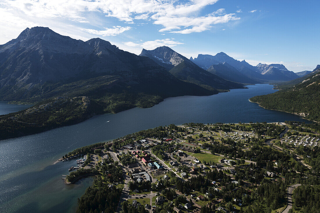 View Of The Buildings In The National Park And The Lake Spanning The Rocky Mountains, Waterton Lakes National Park; Alberta, Canada
